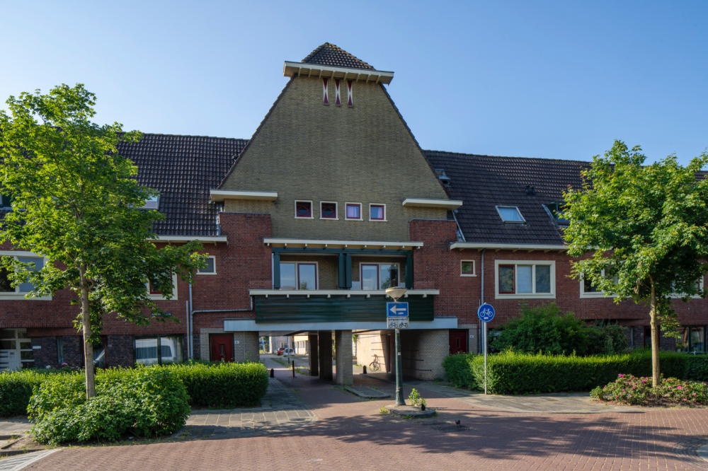 Arbeiderswoningen met winkels